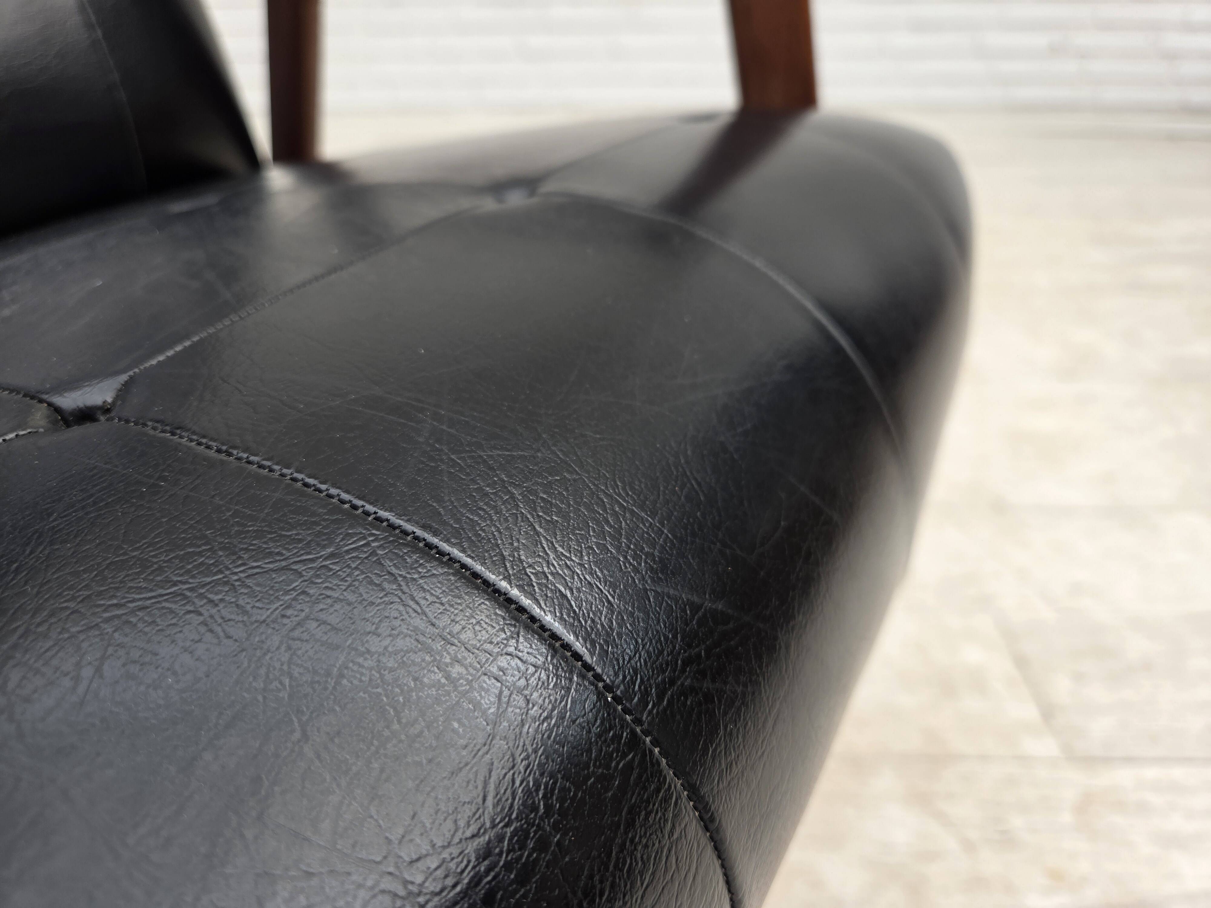 1970s, Danish armchair, black artificial leather, teak wood.