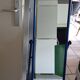 Adjustable mirror on vintage blue tubular structure stand