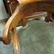 Empire-Charles X walnut office chair with a gondola backrest.