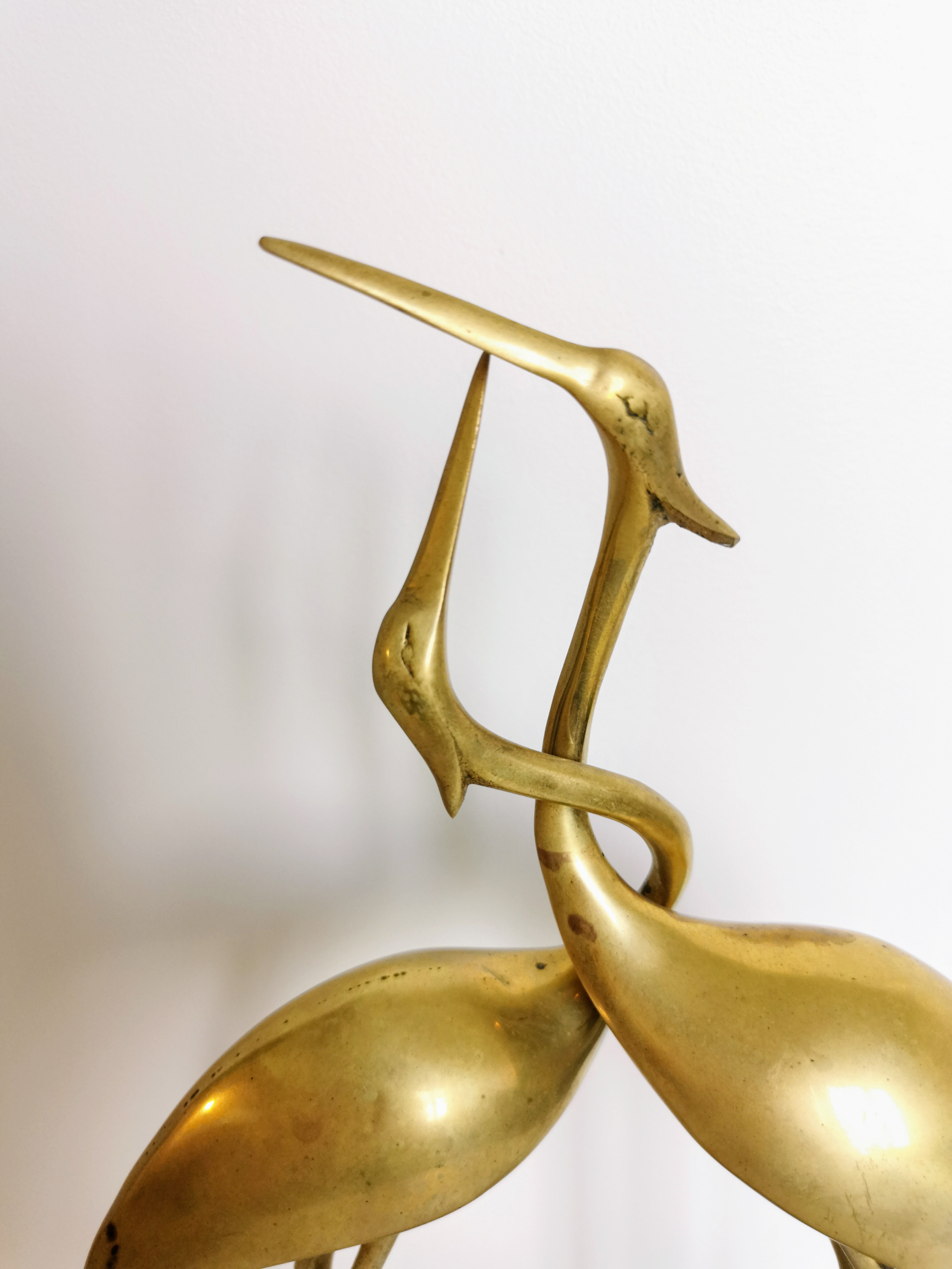 Couple of brass herons