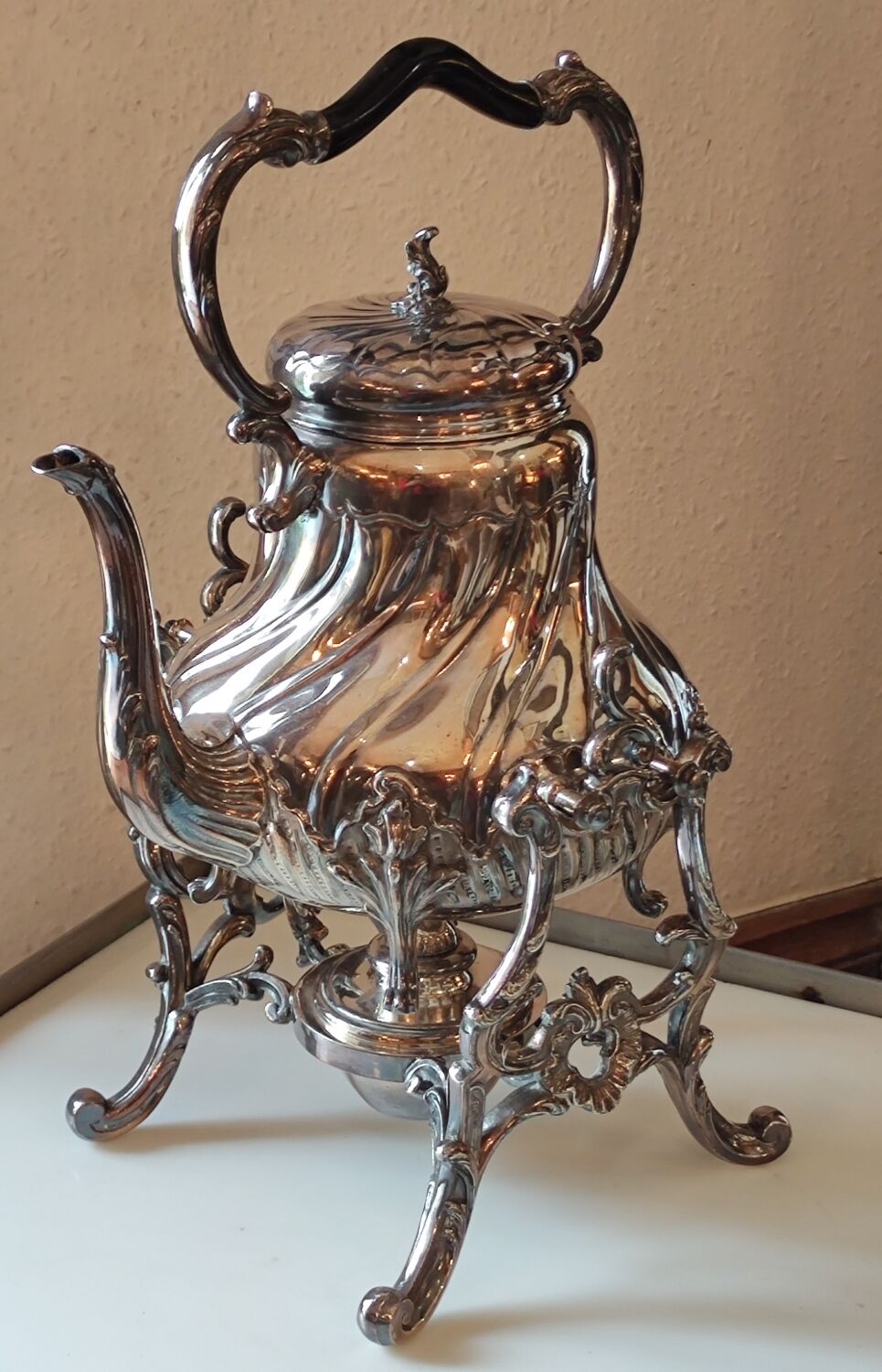 Ancient samovar tea fountain in silver metal