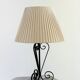 Vintage wrought iron table lamp in swirl shape with pleated shade
