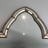 Mirror consisting of multi-faceted mirrors and brass garlands, French work, around 1970