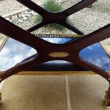 Chic serving table on wheels from the 60s with brass decorations and two shelves.