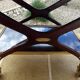 Chic serving table on wheels from the 60s with brass decorations and two shelves.