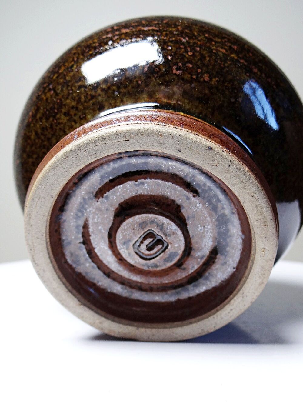 Brown and green glazed stoneware flower holder, vintage craftsmanship from the 1970s-1980s.