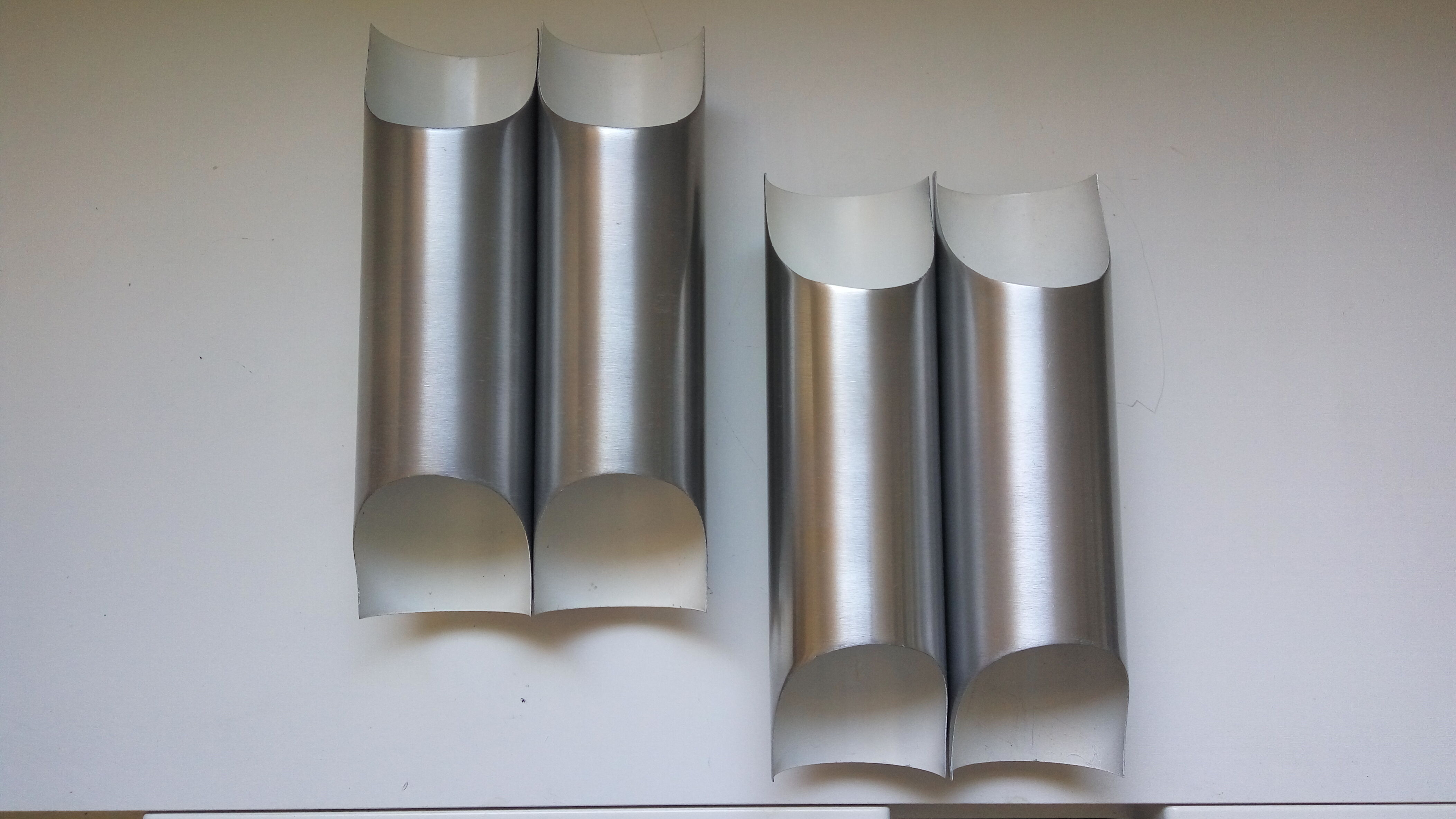 Pair of wall sconces by Fugue Raak