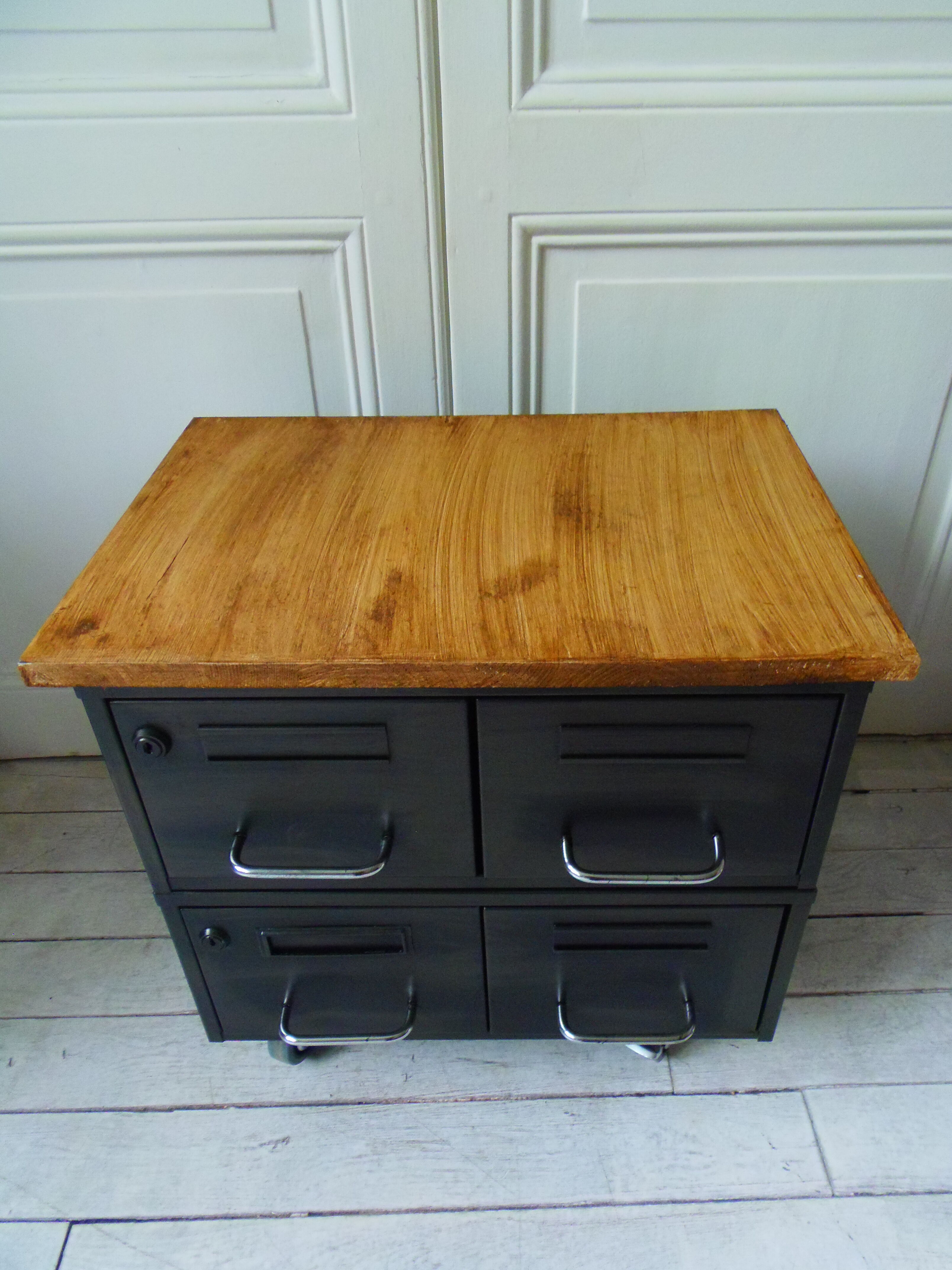 Vintage furniture with metal plugs on black wheels wooden tray