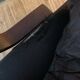 Vintage leather armchair with wooden armrests