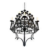 Lustre with 12 lights in wrought iron decorated with clovers and foliage.