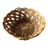 Large vintage twisted wicker basket on a stand