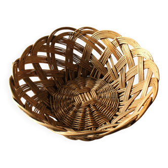 Large vintage twisted wicker basket on a stand
