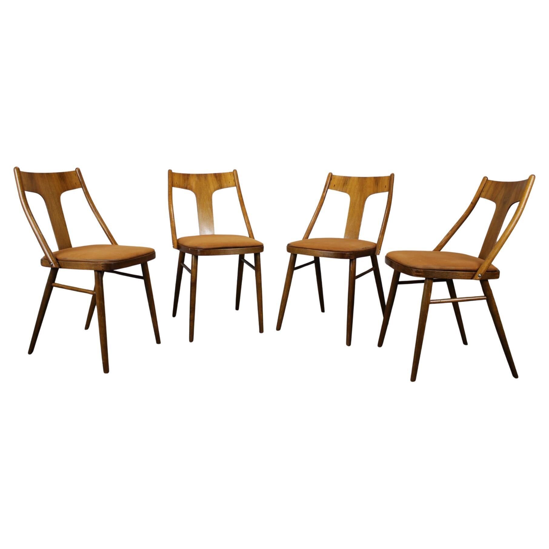 Set of four walnut dining chairs, Czechoslovakia, 1950s