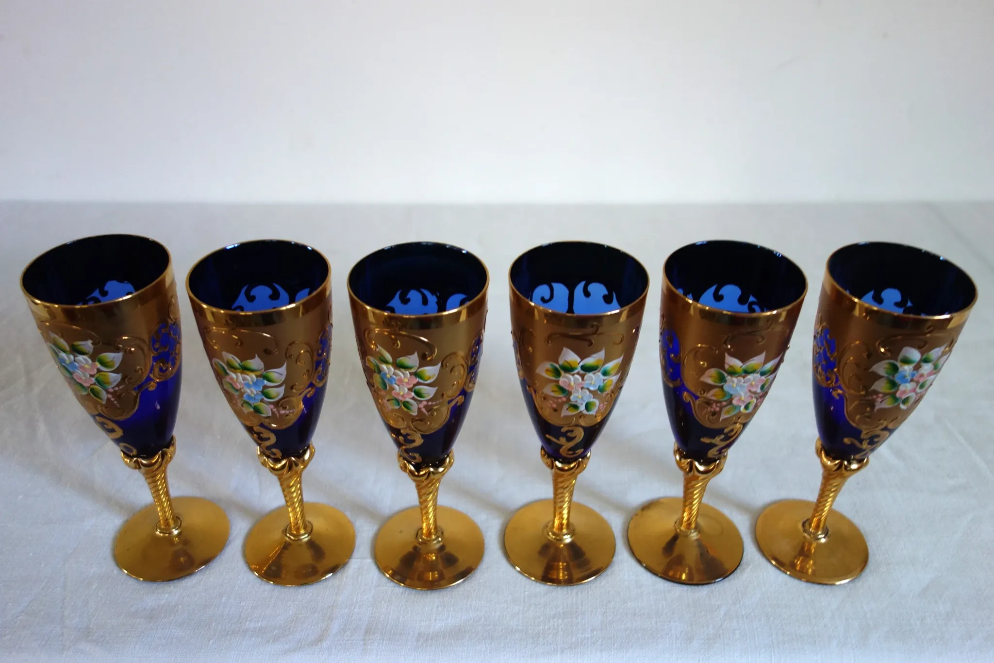 12 cobalt blue and gold Murano glass flutes, mid-20th century.