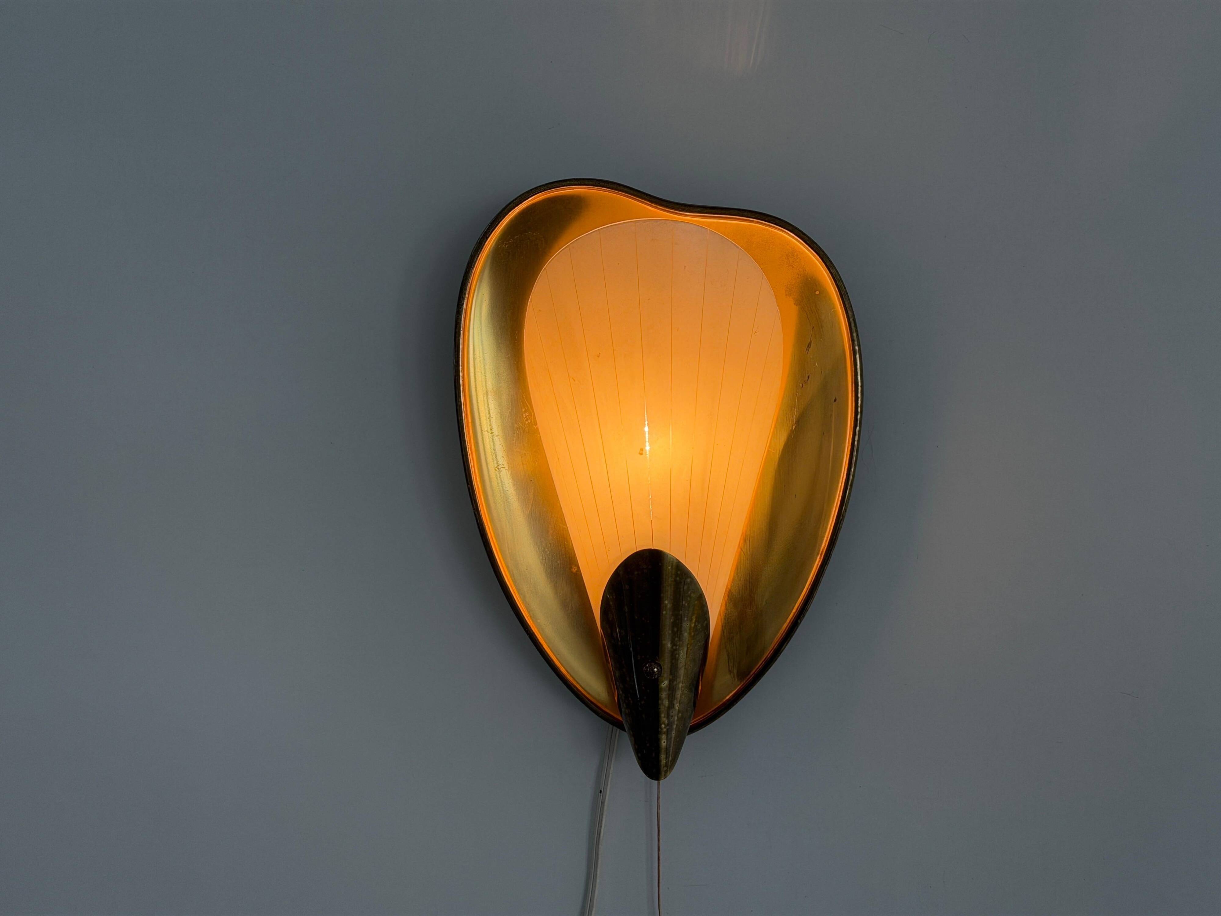 Pair of brass and glass wall lights from the mid-century, 1950s, Germany.
