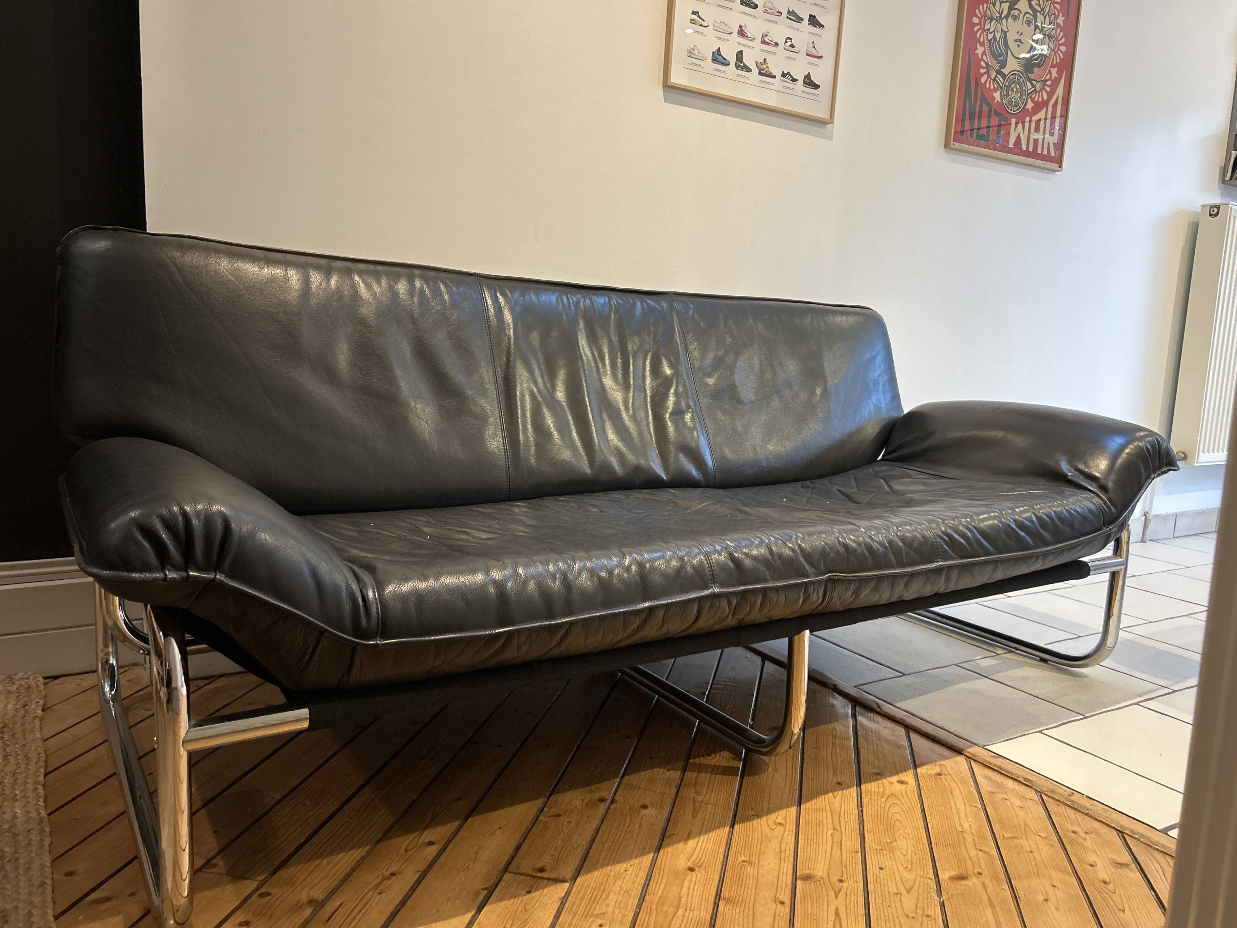 Black leather sofa designed by Johan Bertil Häggström