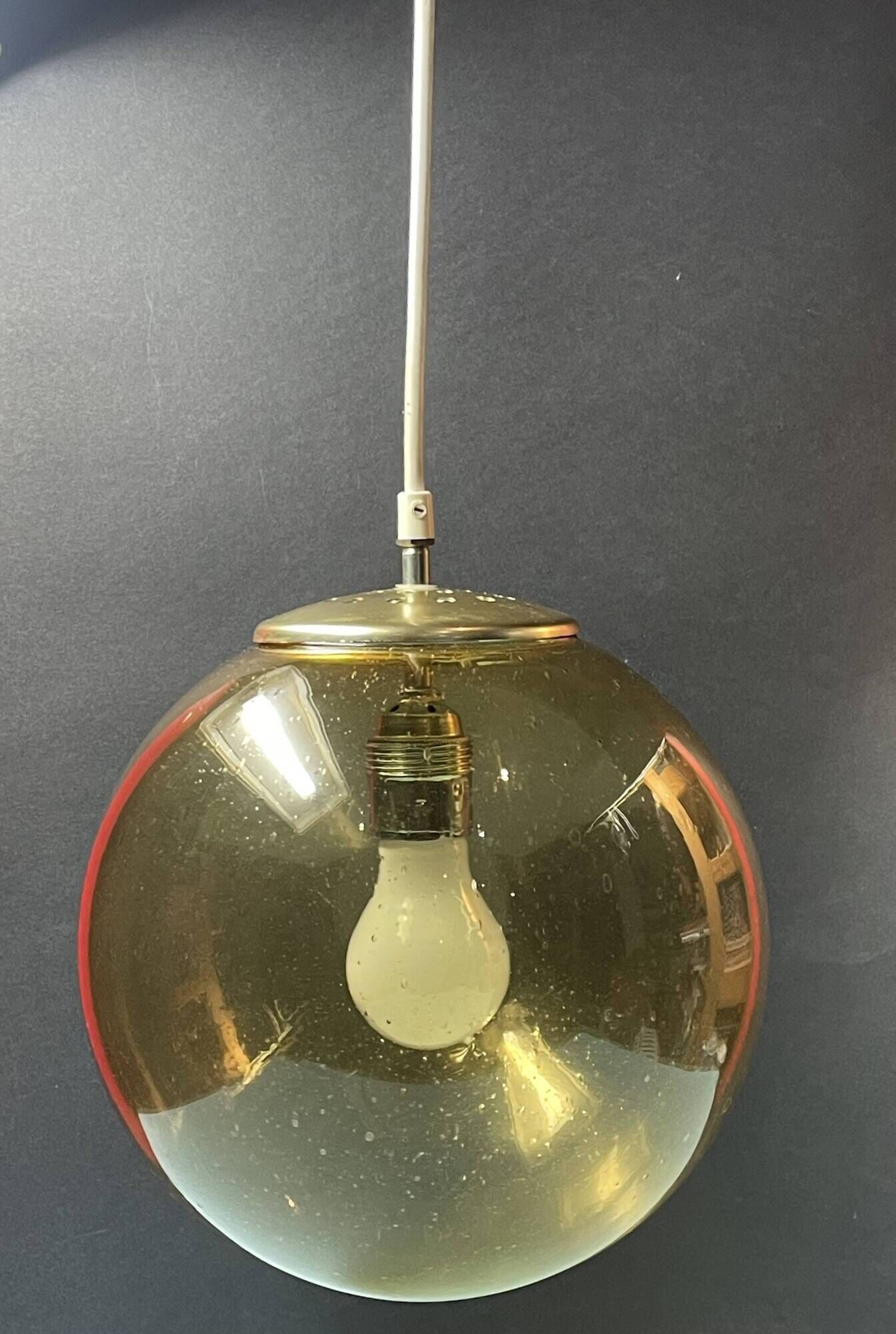 Pair of vintage smoked glass ball pendant lights from Biot glassworks