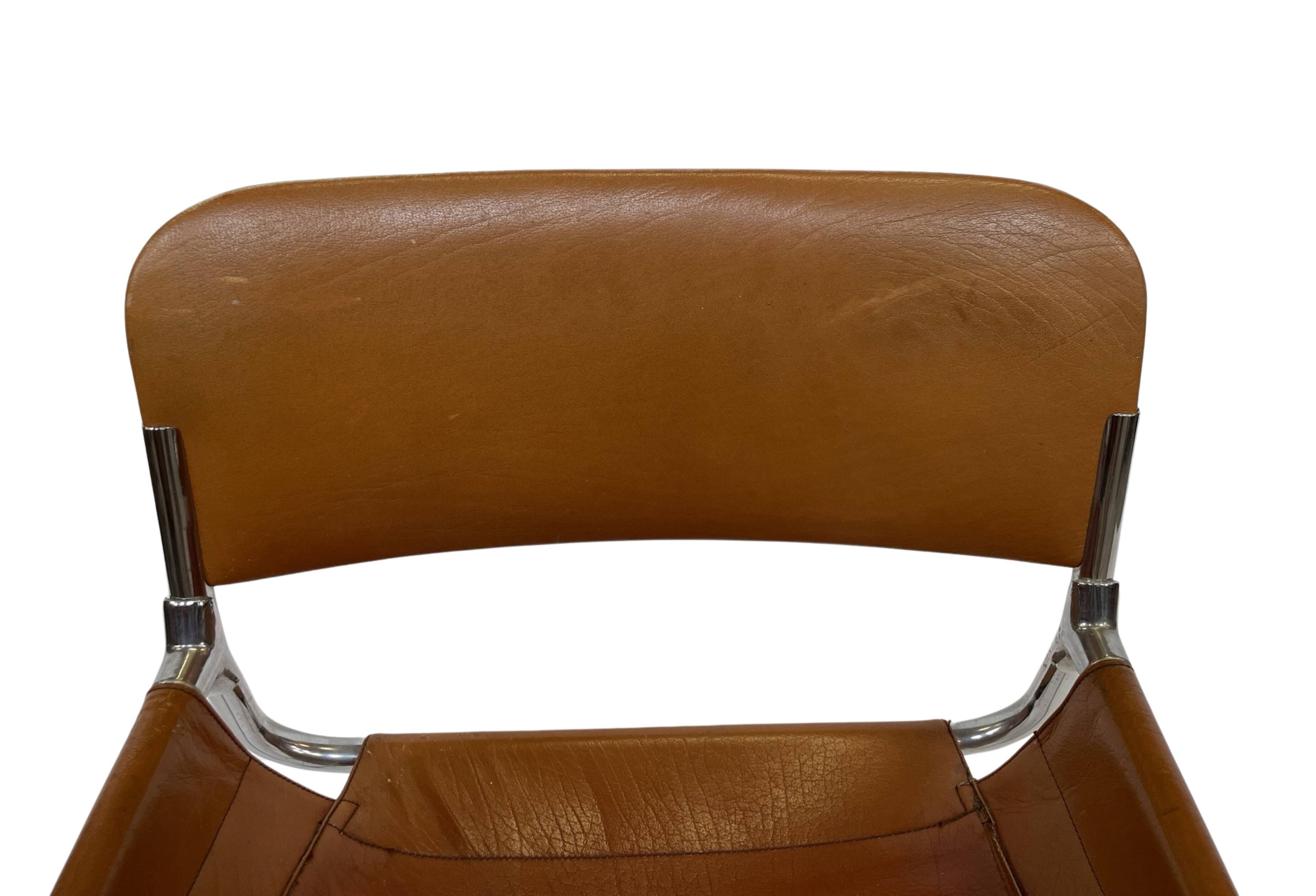 vintage dining room chair in cognac leather and chrome 1970s Italy