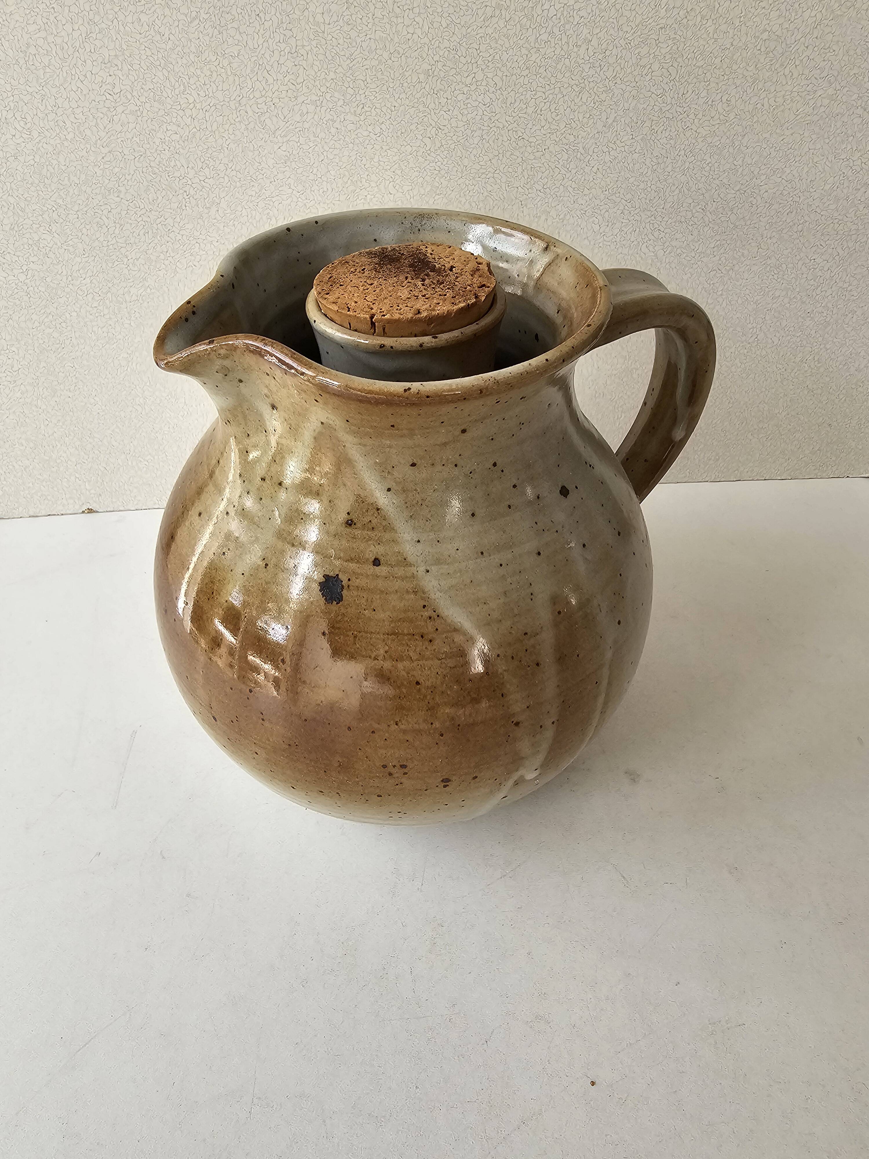 Signed, poured ceramic wine pitcher (signature to be identified)