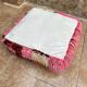 Berber floor pouf: Handwoven Moroccan wool cushion.