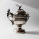 Vintage 1930s silver-plated footed bowl with lid by Warren Rogers New York, featuring a bird motif and ornate details.