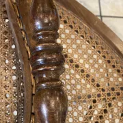 Pair of antique caned and wooden chairs from the 1900s.
