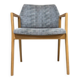 Vintage armchair from the 60s/70s in wood and grey fabric – with armrests.