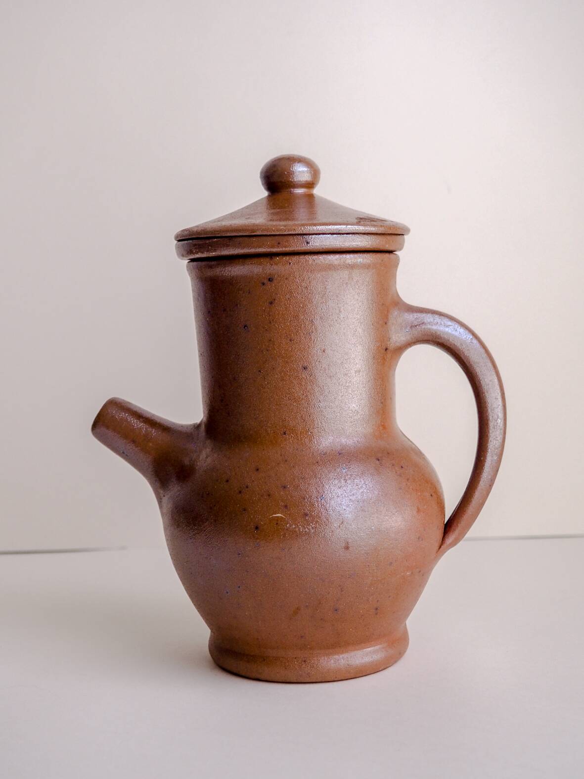 Handcrafted stoneware teapot with strainer