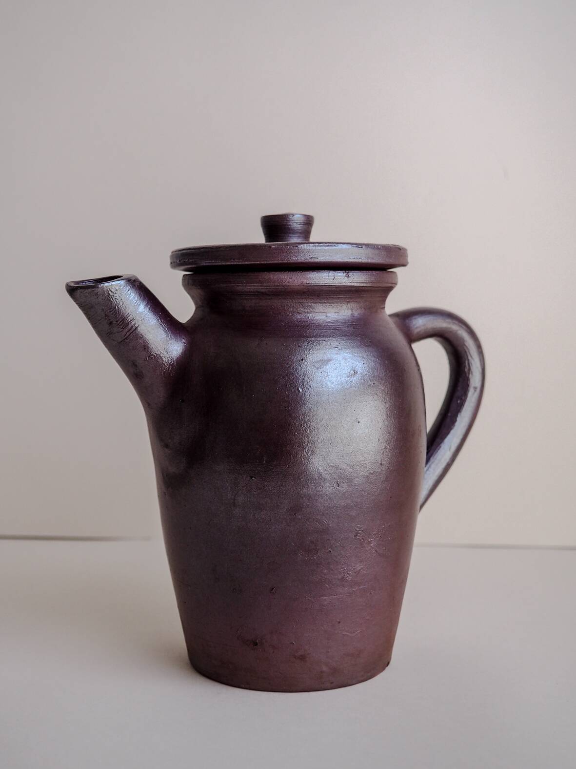 Brown ceramic artisan coffee maker