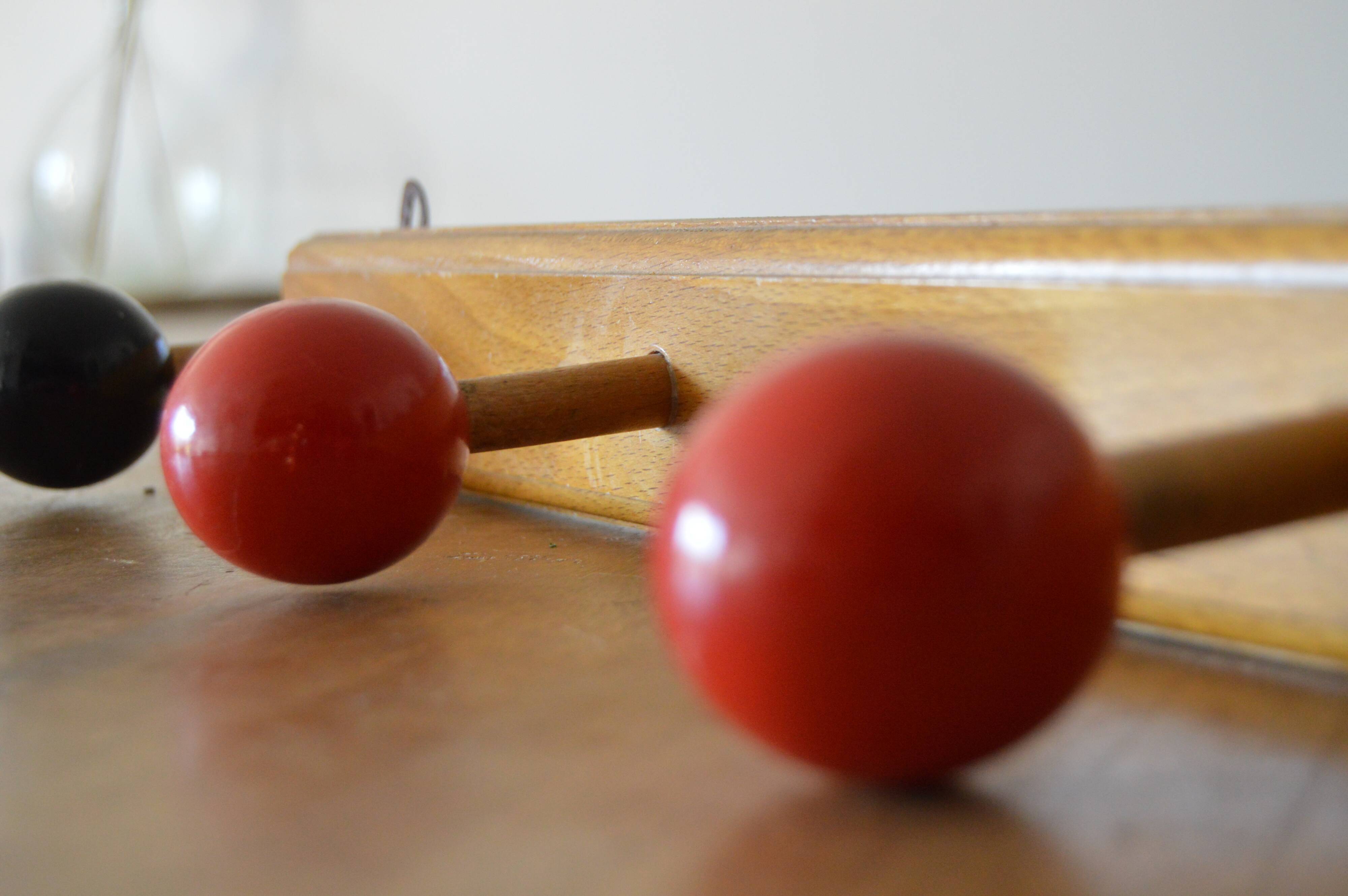 Vintage wooden hook with 4 racks painted red and black