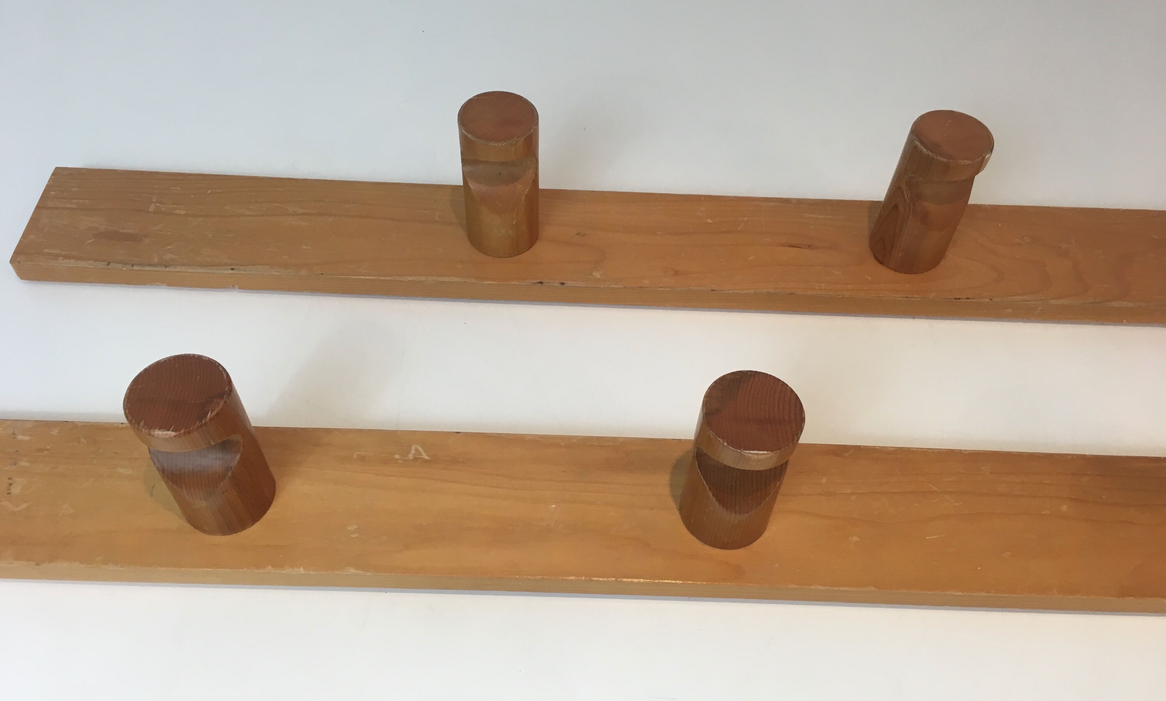 Charlotte Perriand, pair of fir wall coat racks, French work, around 1970