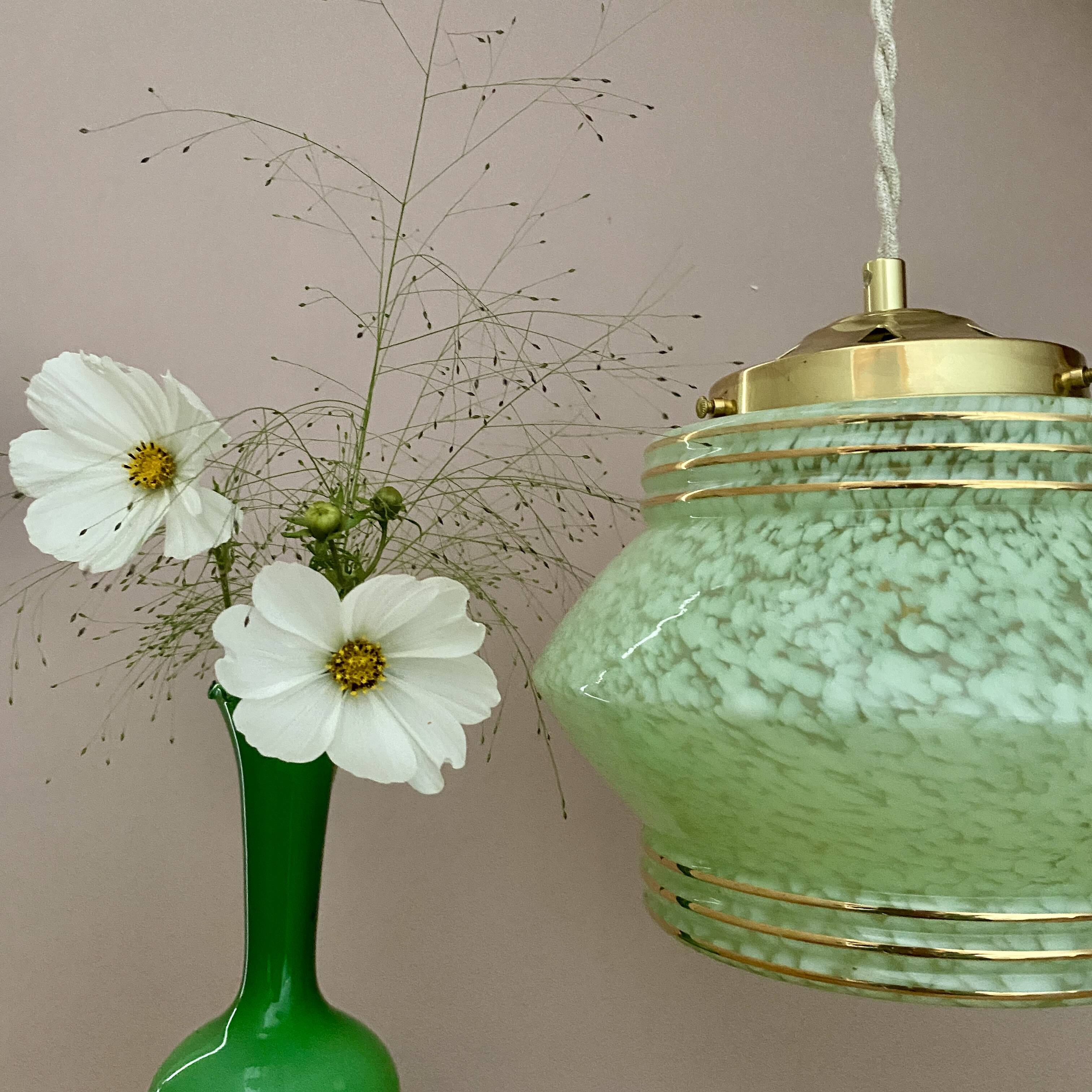 Art Deco globe pendant light in mint green and gold Clichy glass