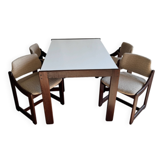 Mid-century white laminate dining table with dark wood base and 4 beige upholstered chairs