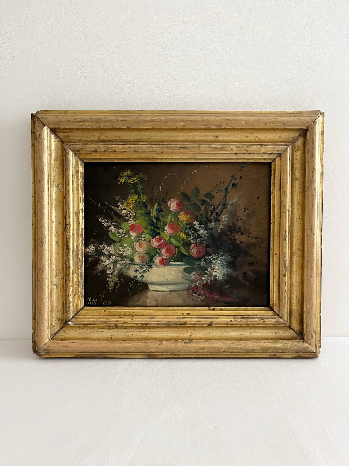 Old oil painting on wood of a bouquet of flowers signed Petit.