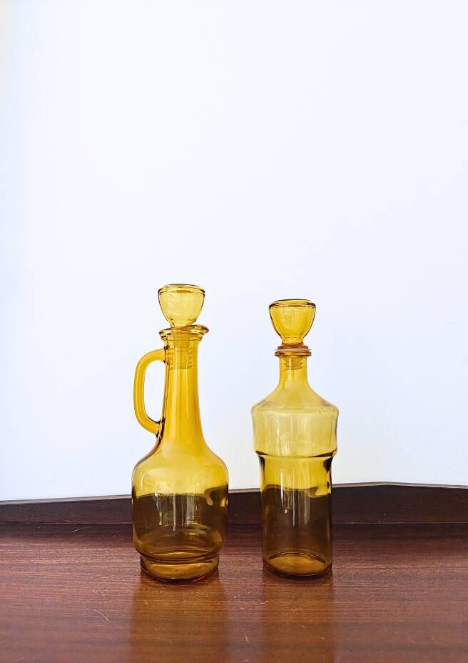 Set of two vintage amber glass carafes attributed to Lubiana.