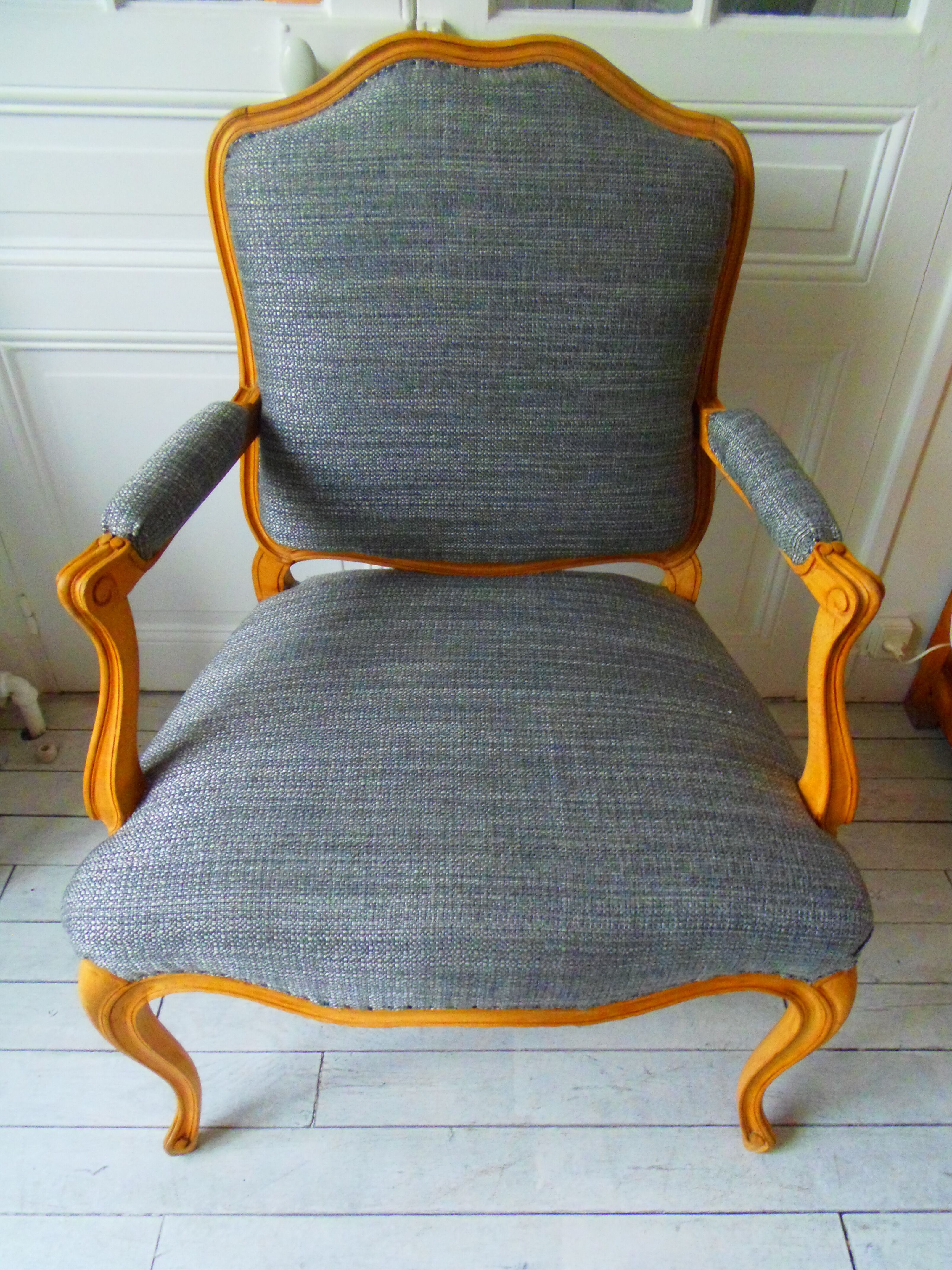 Louis XV style chair trim lined with a mottled grey wool, medium oak waxed finish