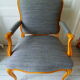 Louis XV style chair trim lined with a mottled grey wool, medium oak waxed finish