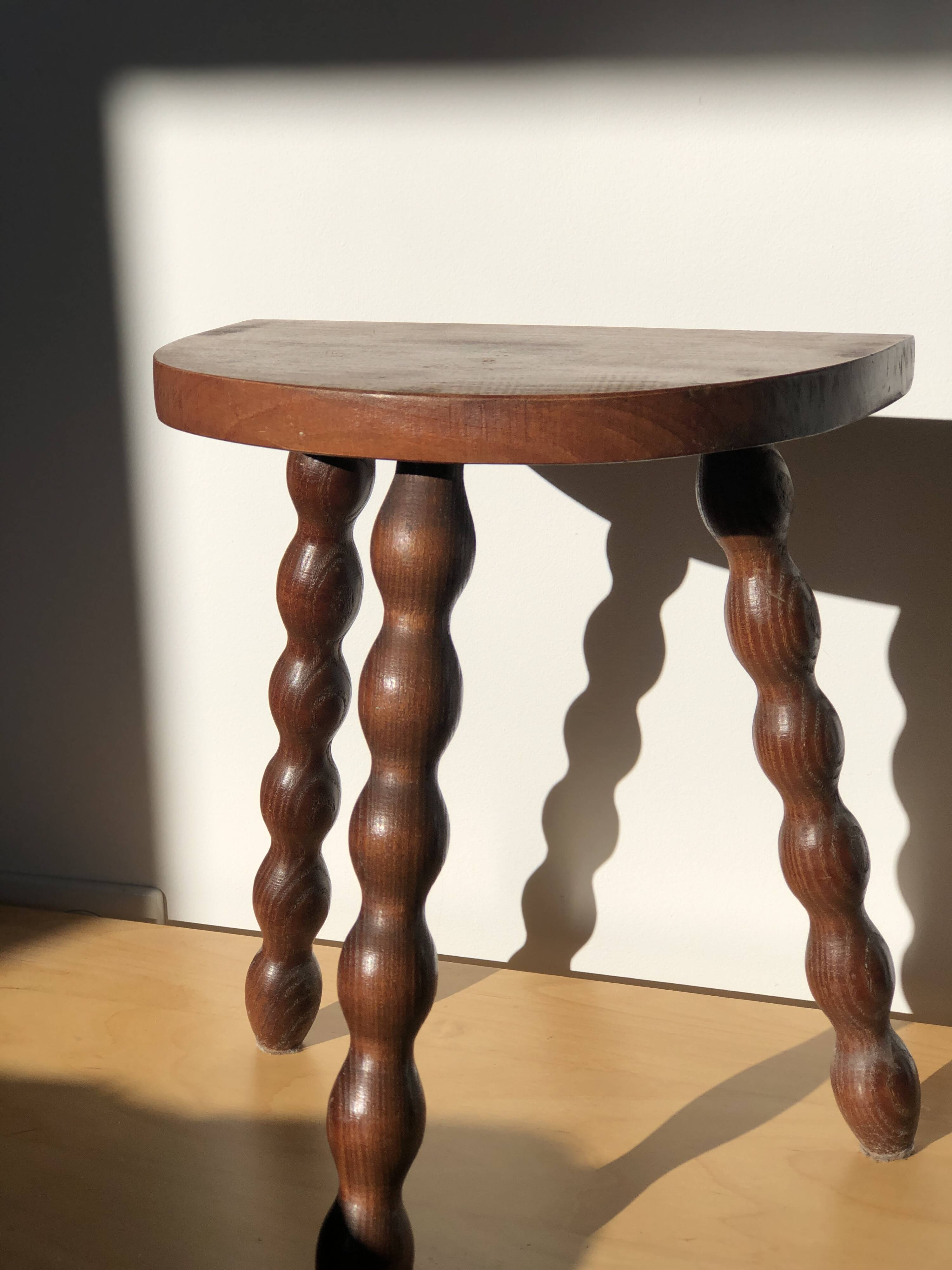 Turned wooden tripod stool