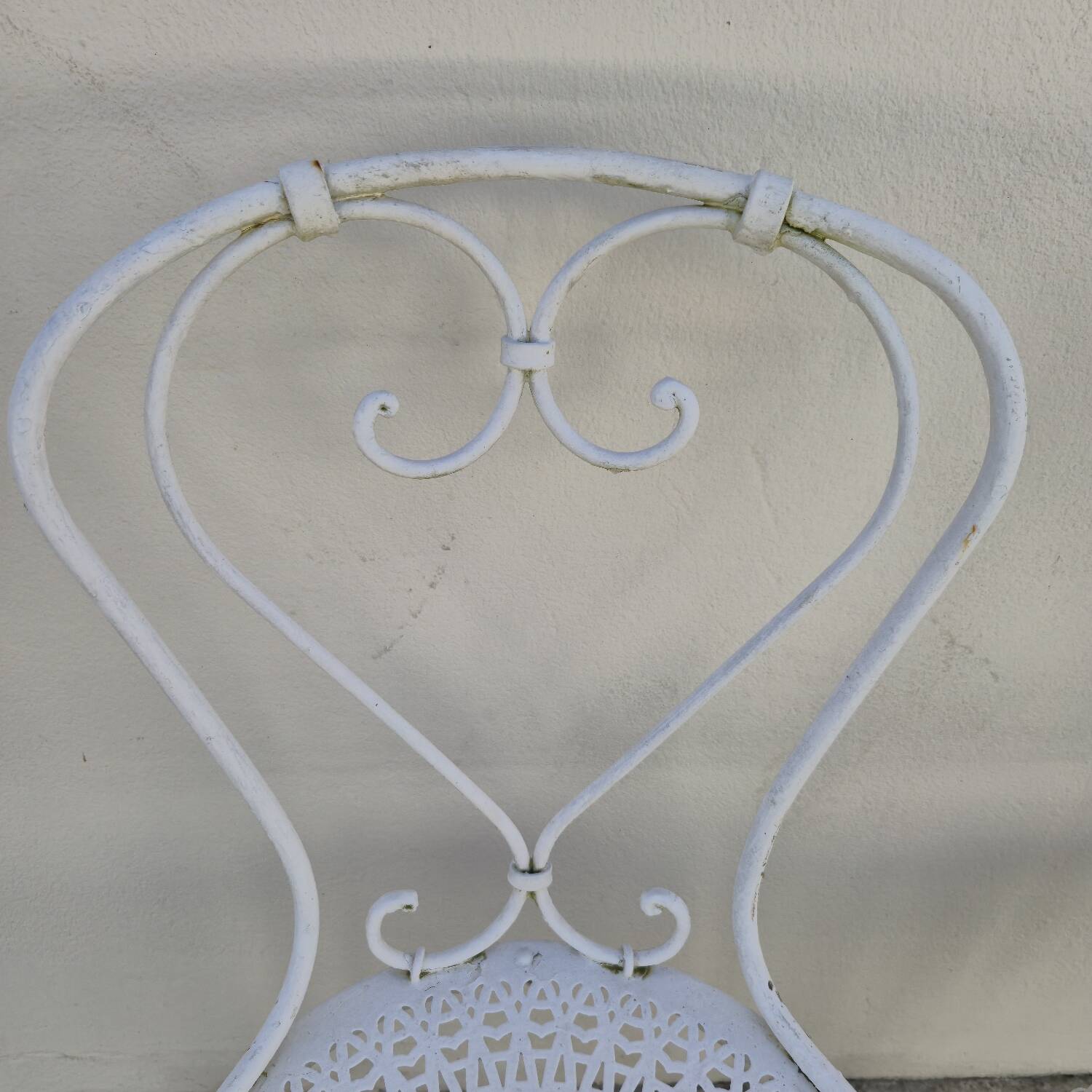 Pair of wrought iron garden chairs, antique manufacture