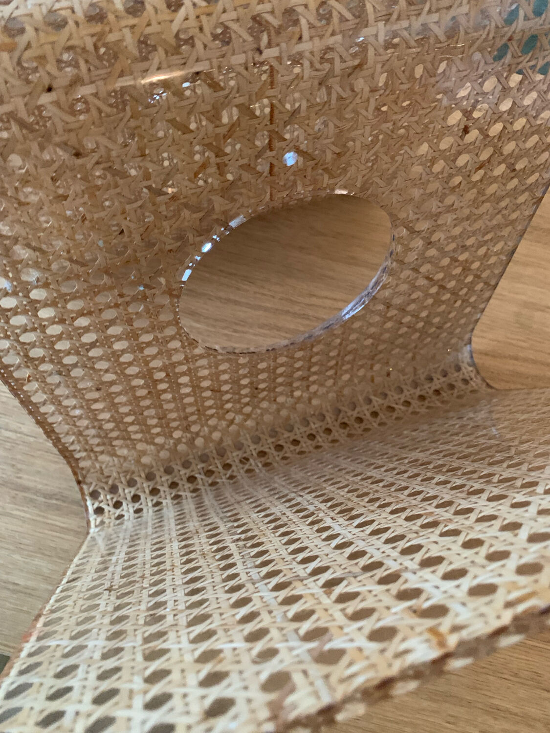 Plexiglass magazine rack with cane work, 1970