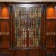 Bibliothèque Theodore Alexander en faux livres en laurier burl