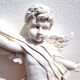 White plaster angel wall decoration
