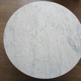 Round marble coffee table with tulip base.