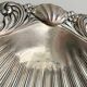 shell-shaped metal pocket tray with patina