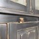 Display cabinet in patinated wood
