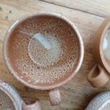 Stoneware coffee service, cups and saucers