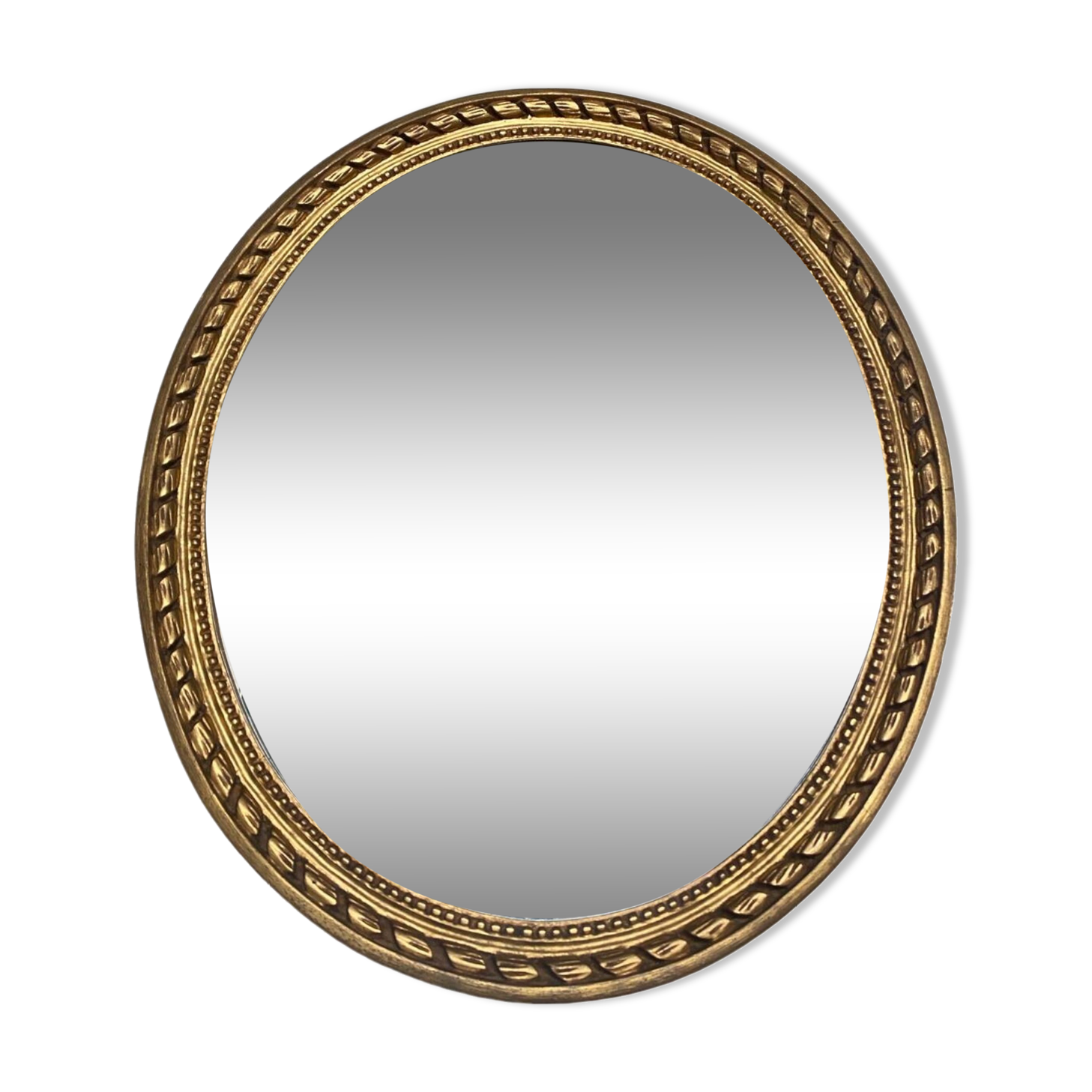 Large oval mirror in wood gilded with fine gold
