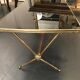 Golden brass table and lion heads circa 1950