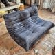 Togo sofa by Ligne Roset and its pouf from the 1970s.