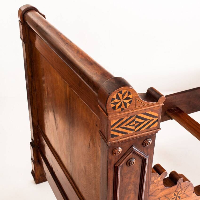 Bed made of solid walnut with marquetry details. France, 1930s.